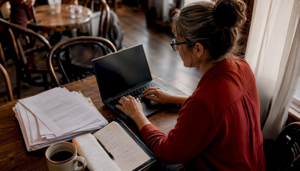 Woman checking warrant status at home laptop