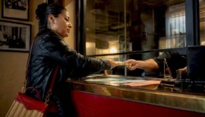 Woman posting bail at jail cashier counter