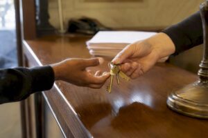 Hands exchanging jail release keys at bail office