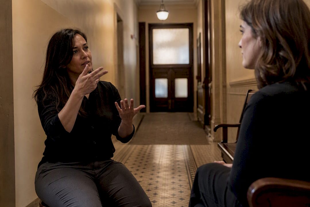 Court interpreter using sign language in courthouse